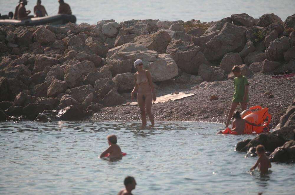 FKK cove pyramid in waters - What is naturist tourism
