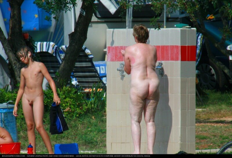 Covered in Towel Nudists-Boardwalk Biking - Nudity is perceived as a natural expression of life