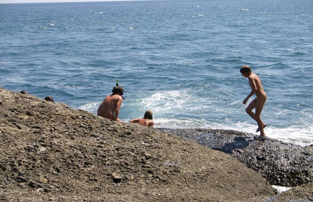Leaning Against Hit Rocks pics - Nudity as a natural part of human existence